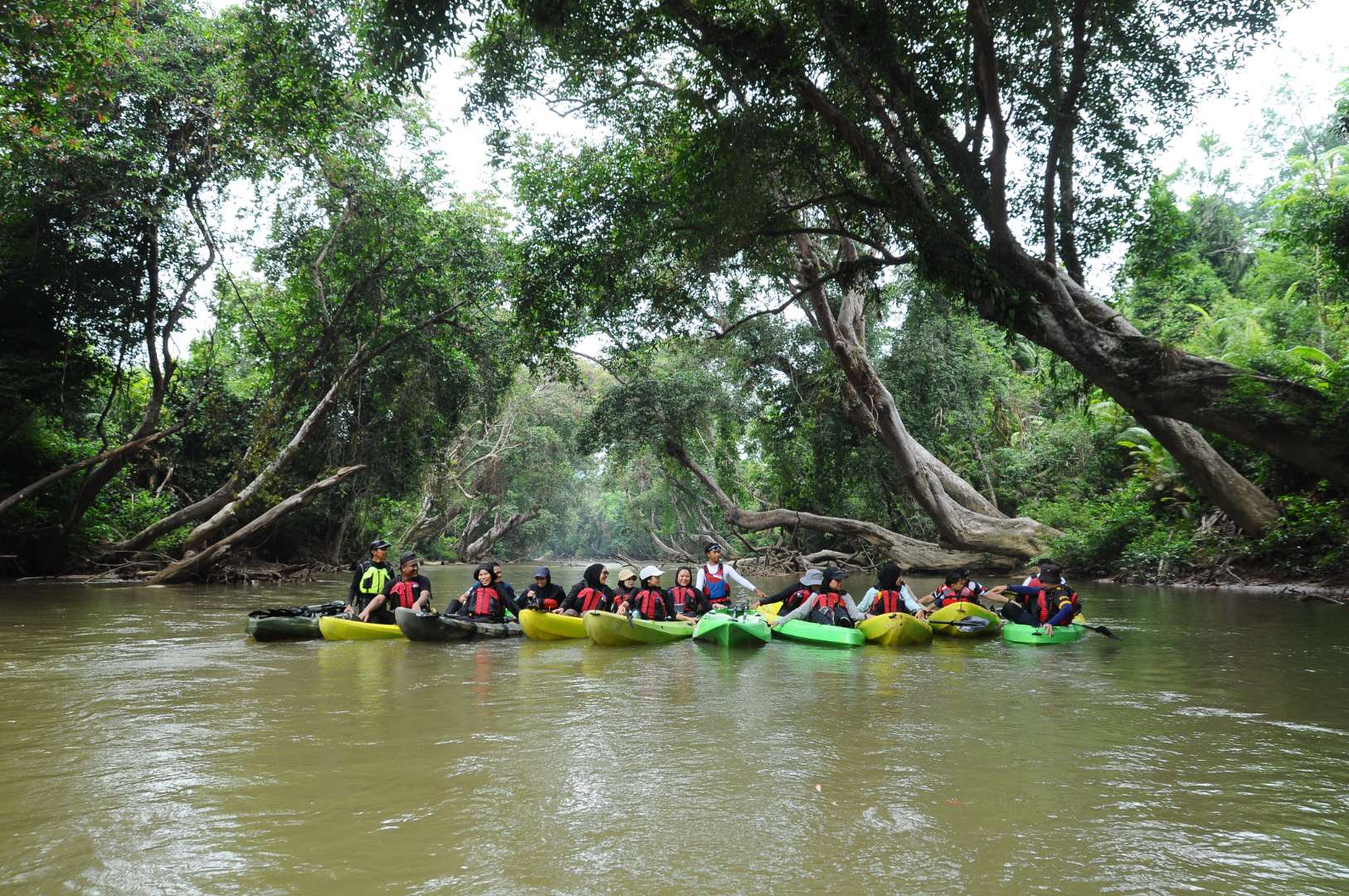 Kayakers on the Terengganu river with Jenoba Outdoor guides